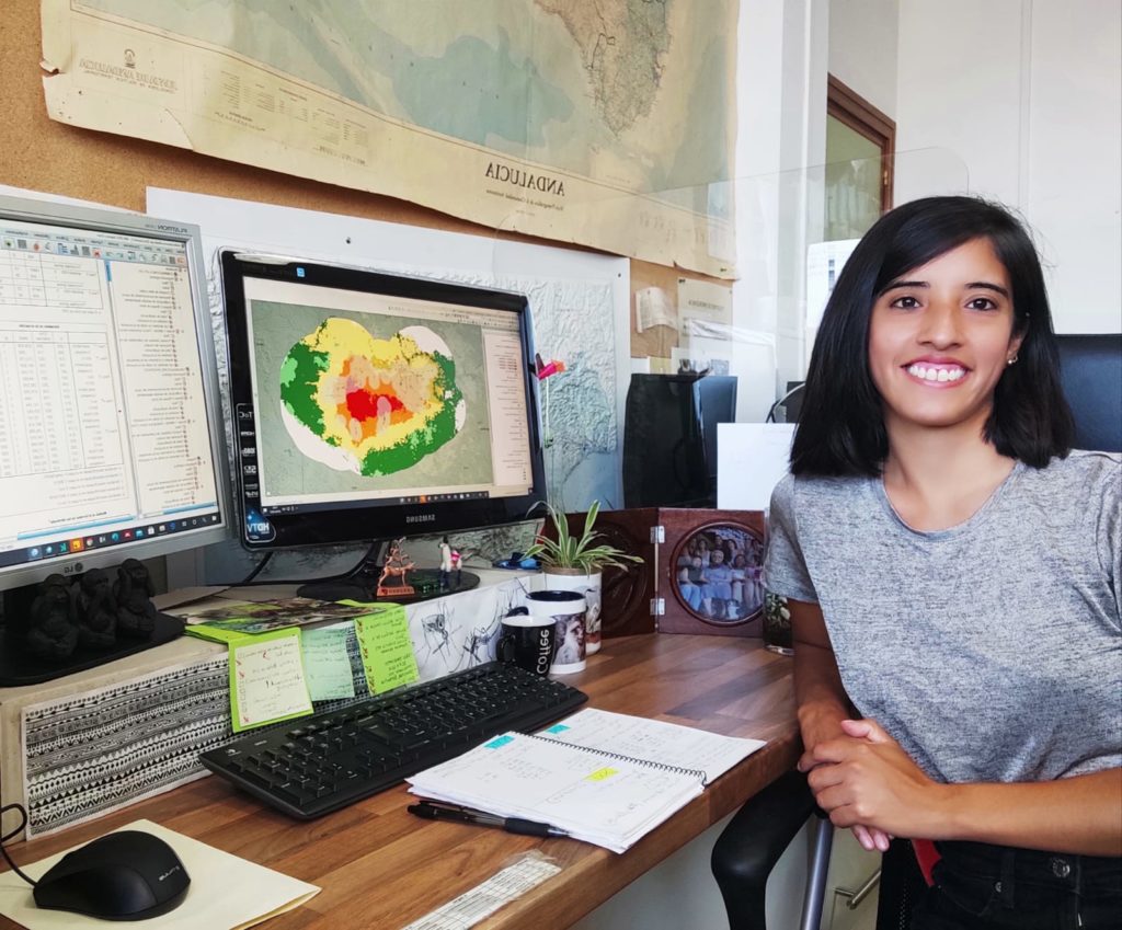 Alisa Aliaga-Samanez sitting by the computer